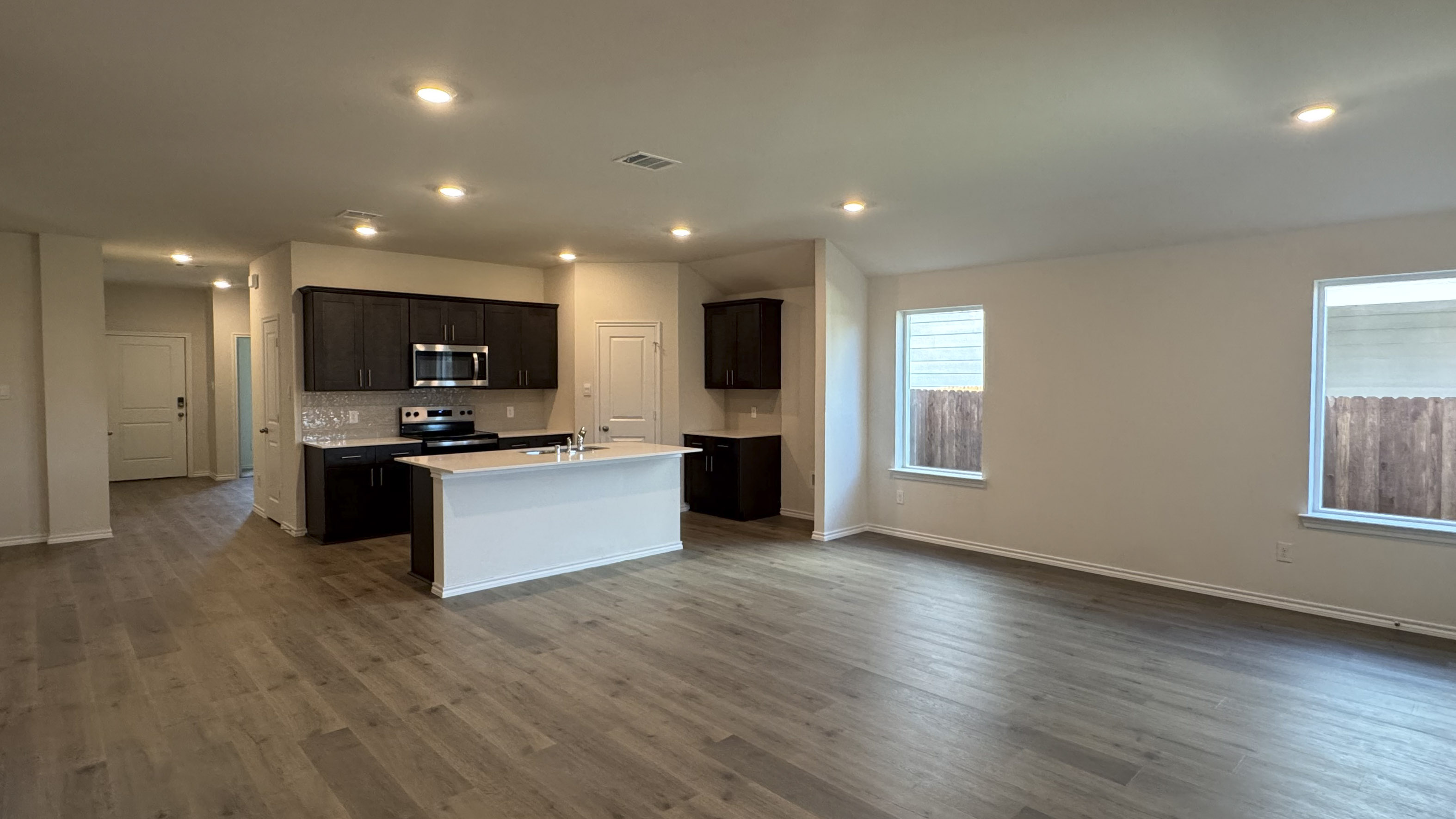 open concept living area with hardwood floors
