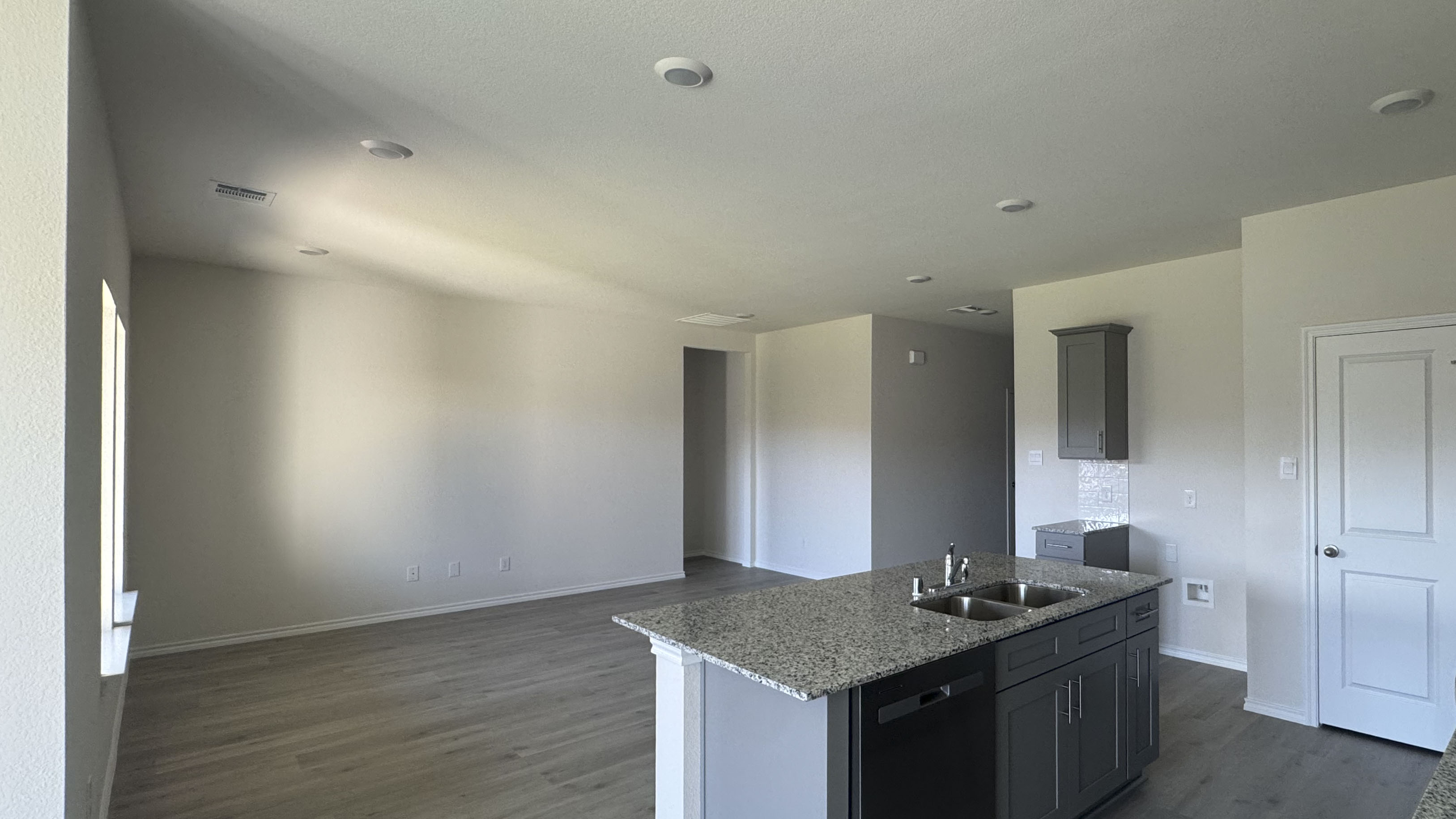 kitchen and living area with hardwood floors