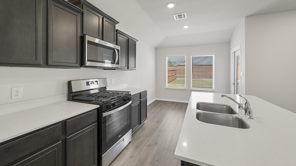 kitchen view showing island with sink