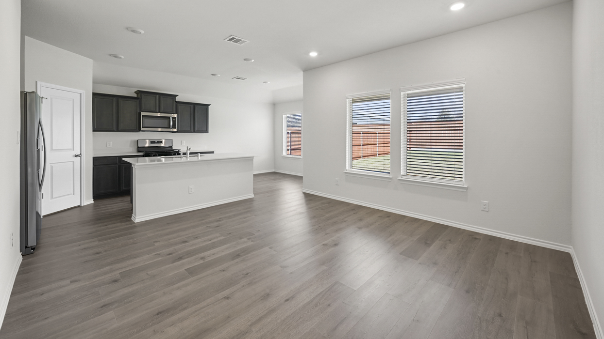 large open concept living room looking into kitchen