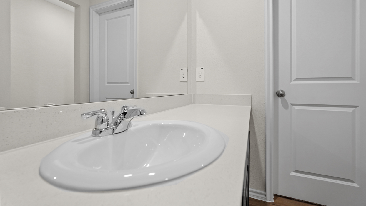a bathroom with a bath tub shower toilet and sink and dark cabinets