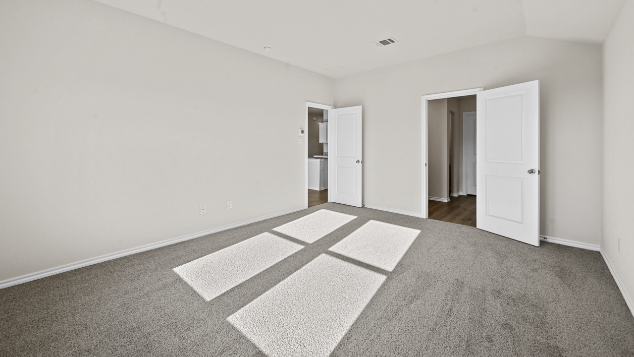 an empty bedroom with gray floors and white walls