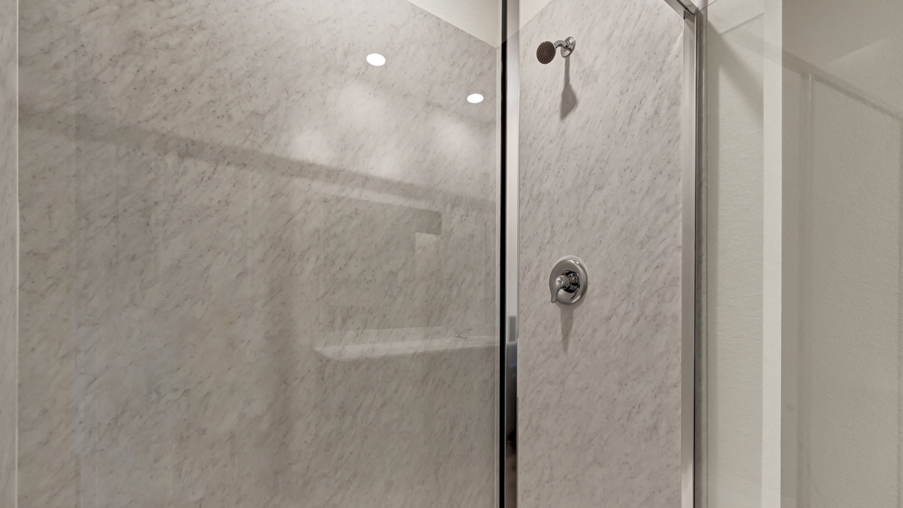 a bathroom with a glass shower