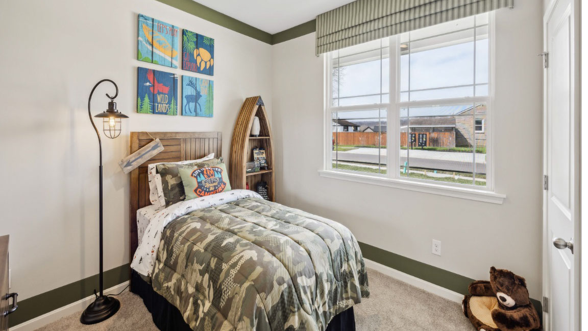 Front spare bedroom with twin bed and dresser
