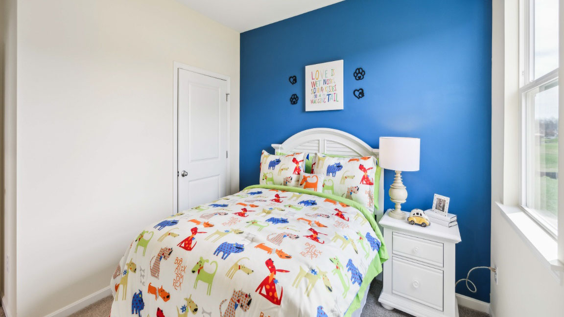 Another view of spare bedroom with bed and closet doors