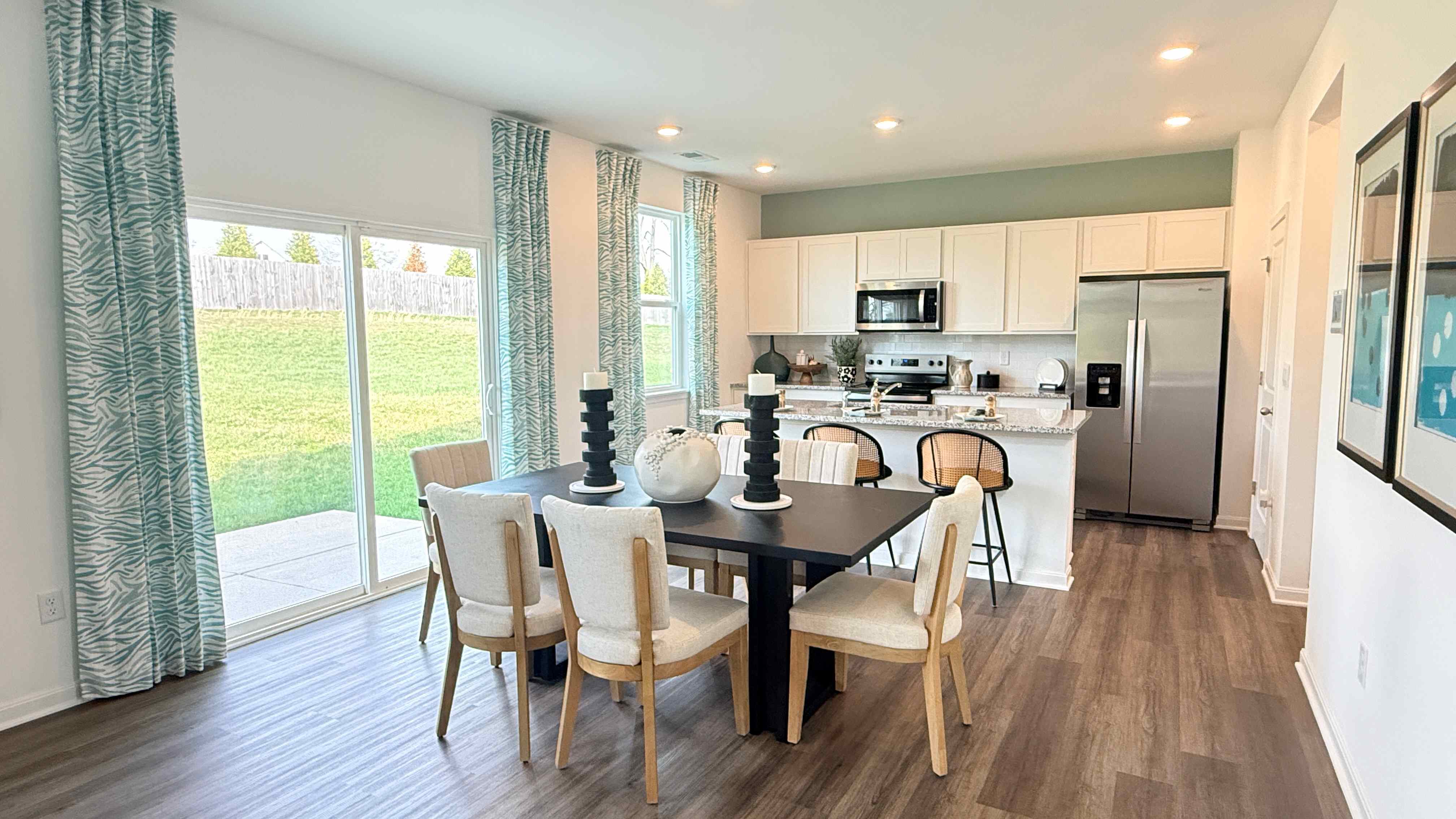 Dining area with rectangular table and 6 chairs.