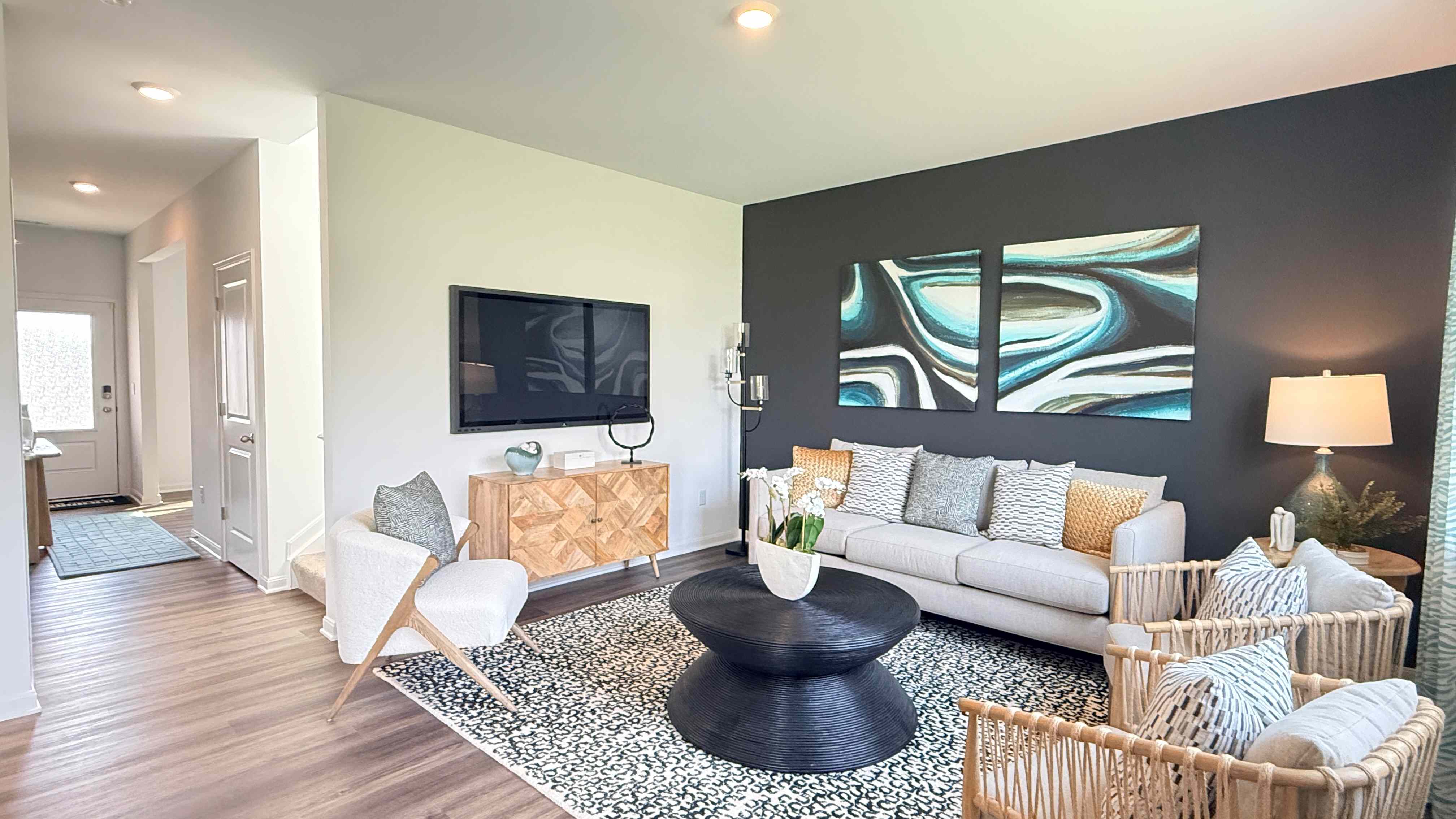 Other view of living room and foyer hallway.
