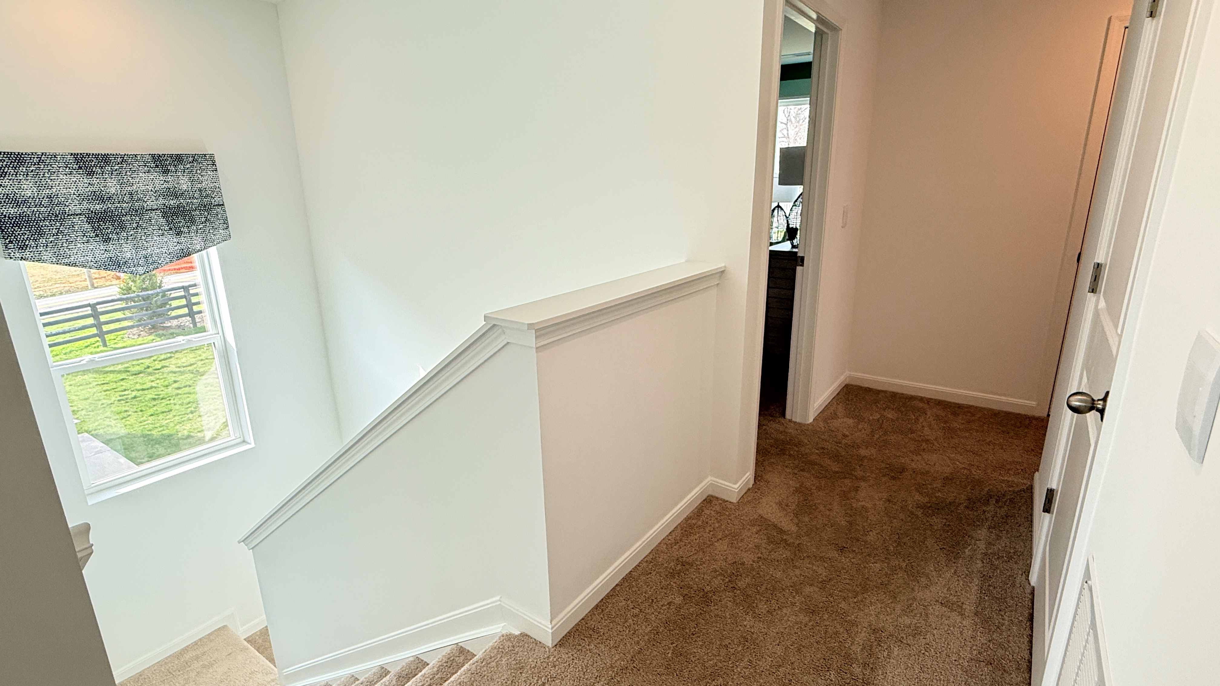 Second floor hallway looking over the stairwell.