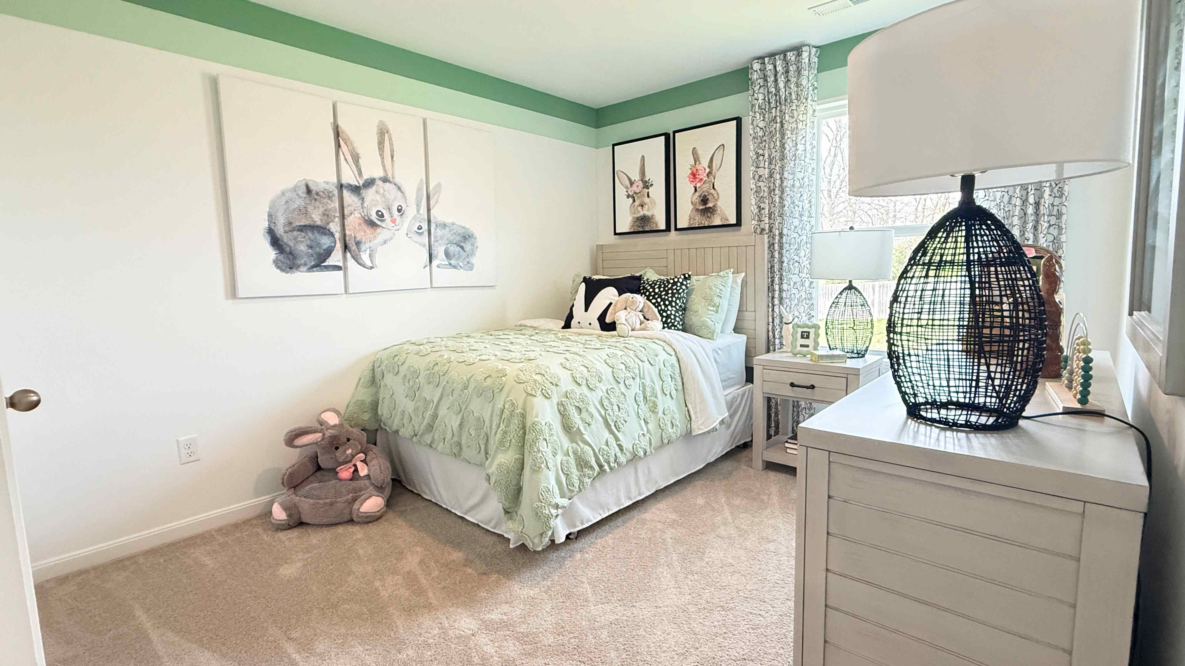 Upstairs spare bedroom with bed, nightstand, single window, and dresser.
