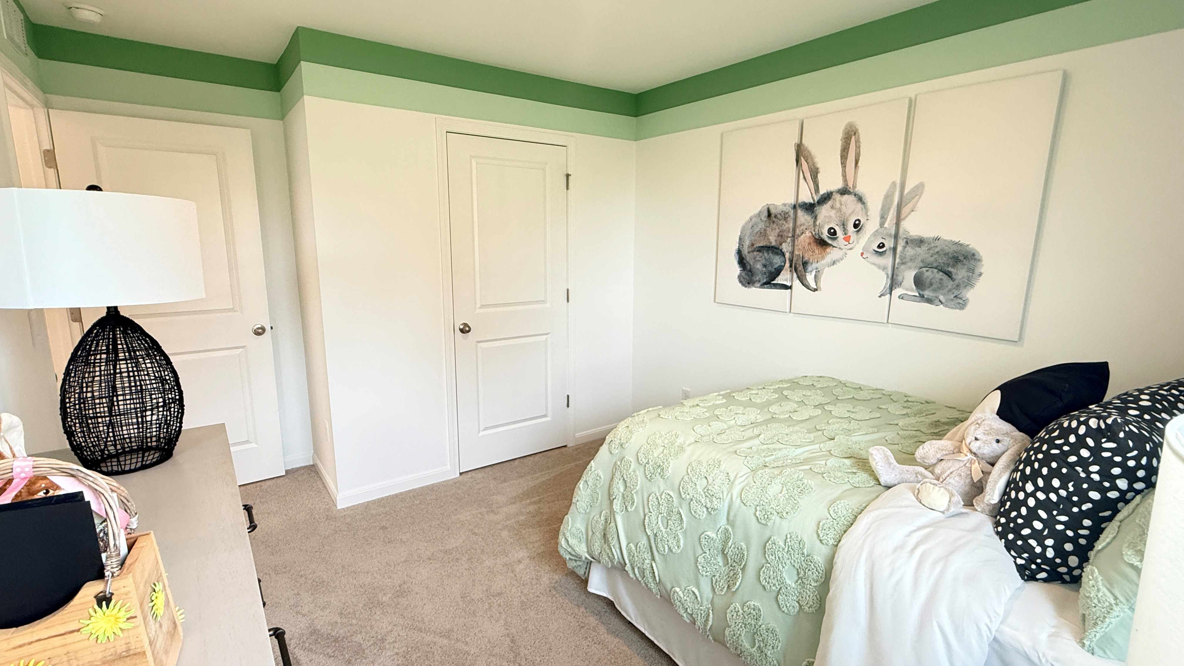 Other view of spare bedroom with rabbit theme.