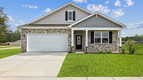 Chatham model home with gray stone front and elements of shake in the gables. Full covered front porch and two car garage with white front door.