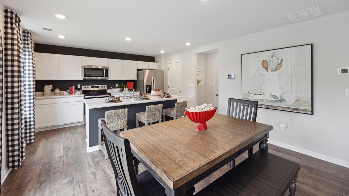 Dining area with rectangular table, 4 chairs, and a bench.