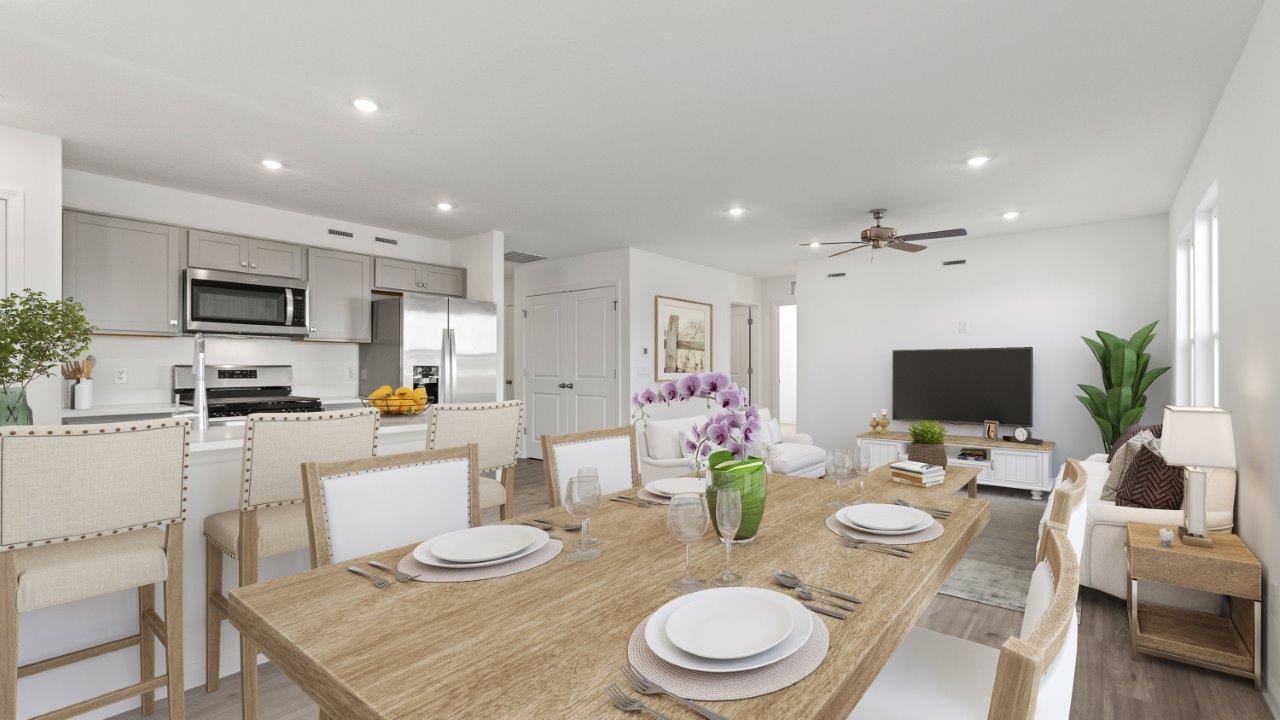 Dining area overlooking kitchen and family room