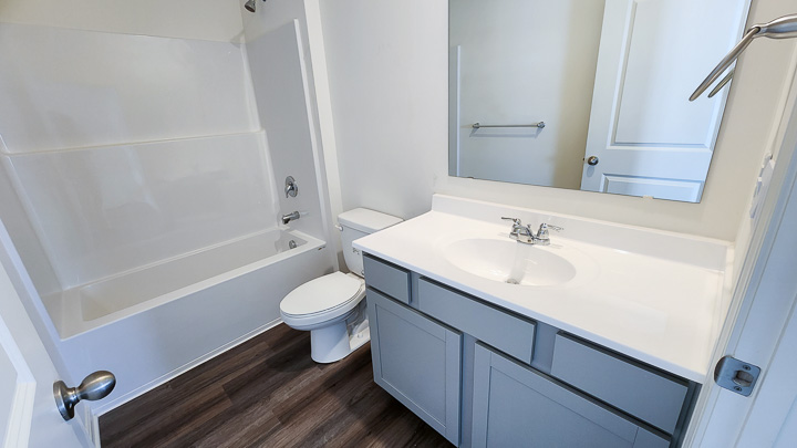 shared full bathroom with bathtub