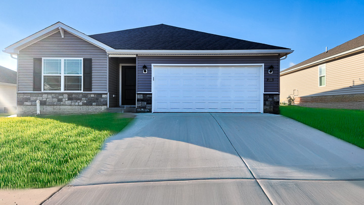 Ranch style home with blue vinyl and stone accents