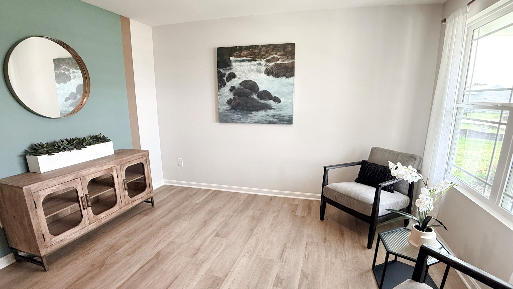 First floor flex room with double window overlooking the front yard.