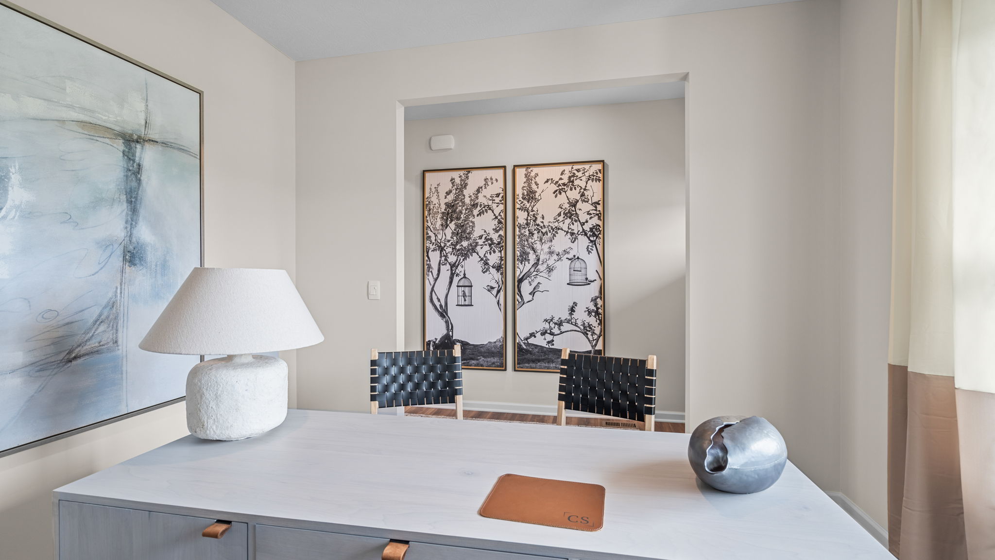 Flex room with desk and 2 chairs.