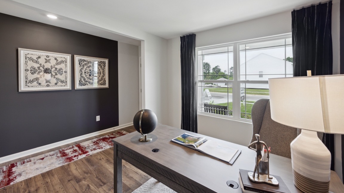 Other view of flex room with desk and double window