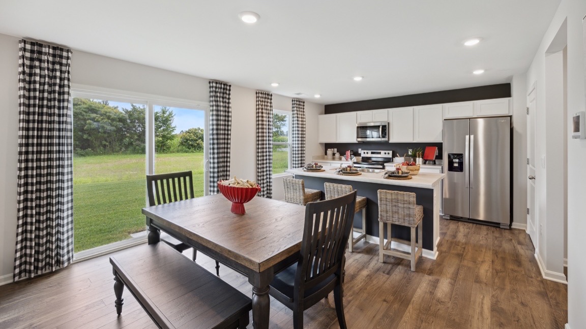 Dining area with table and looking out back door