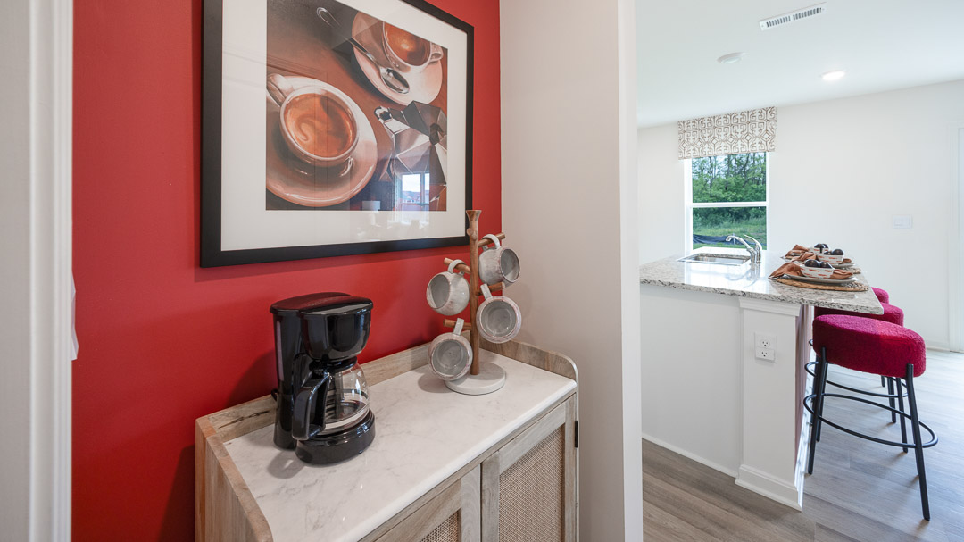 Small nook as you walk in from garage into the kitchen. Decorated with coffee station