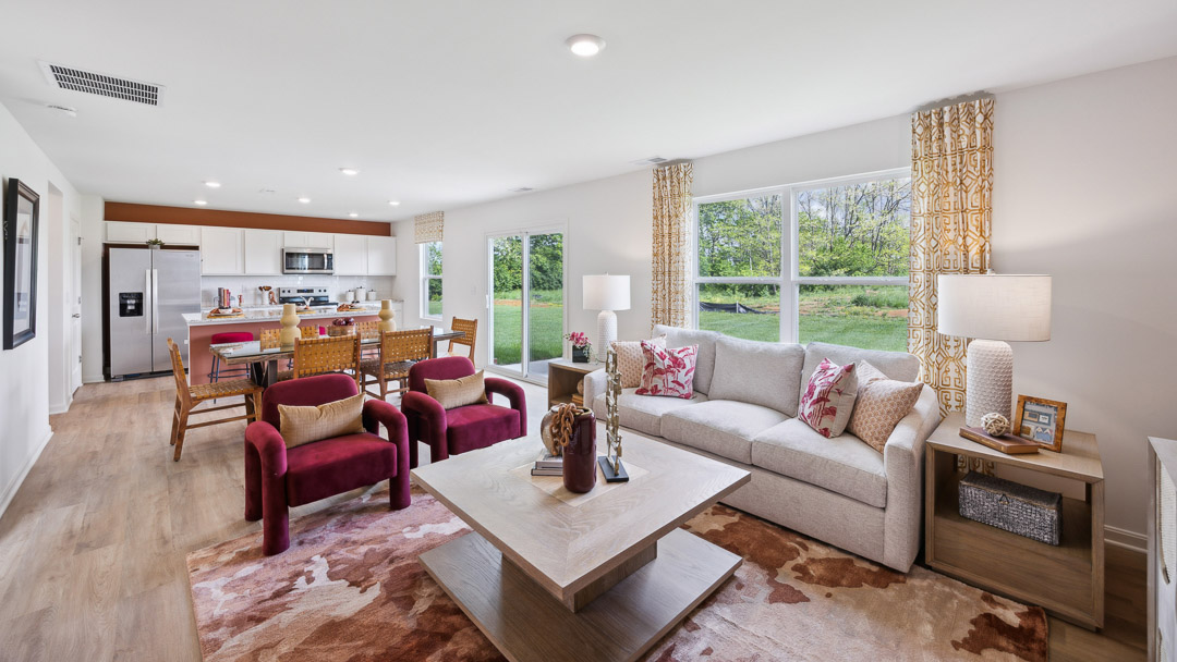 Living room with couch, 2 end tables, square coffee table, and 2 accent chairs.