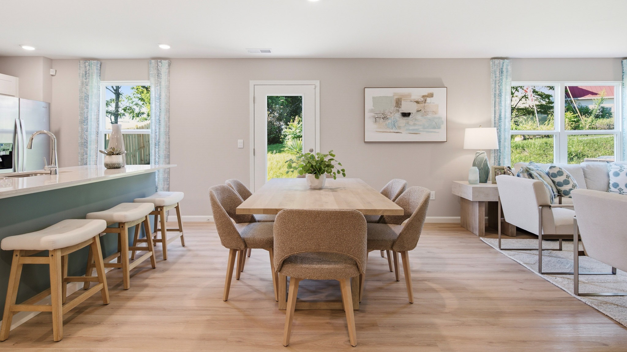 Dining area with rectangular table and chairs.