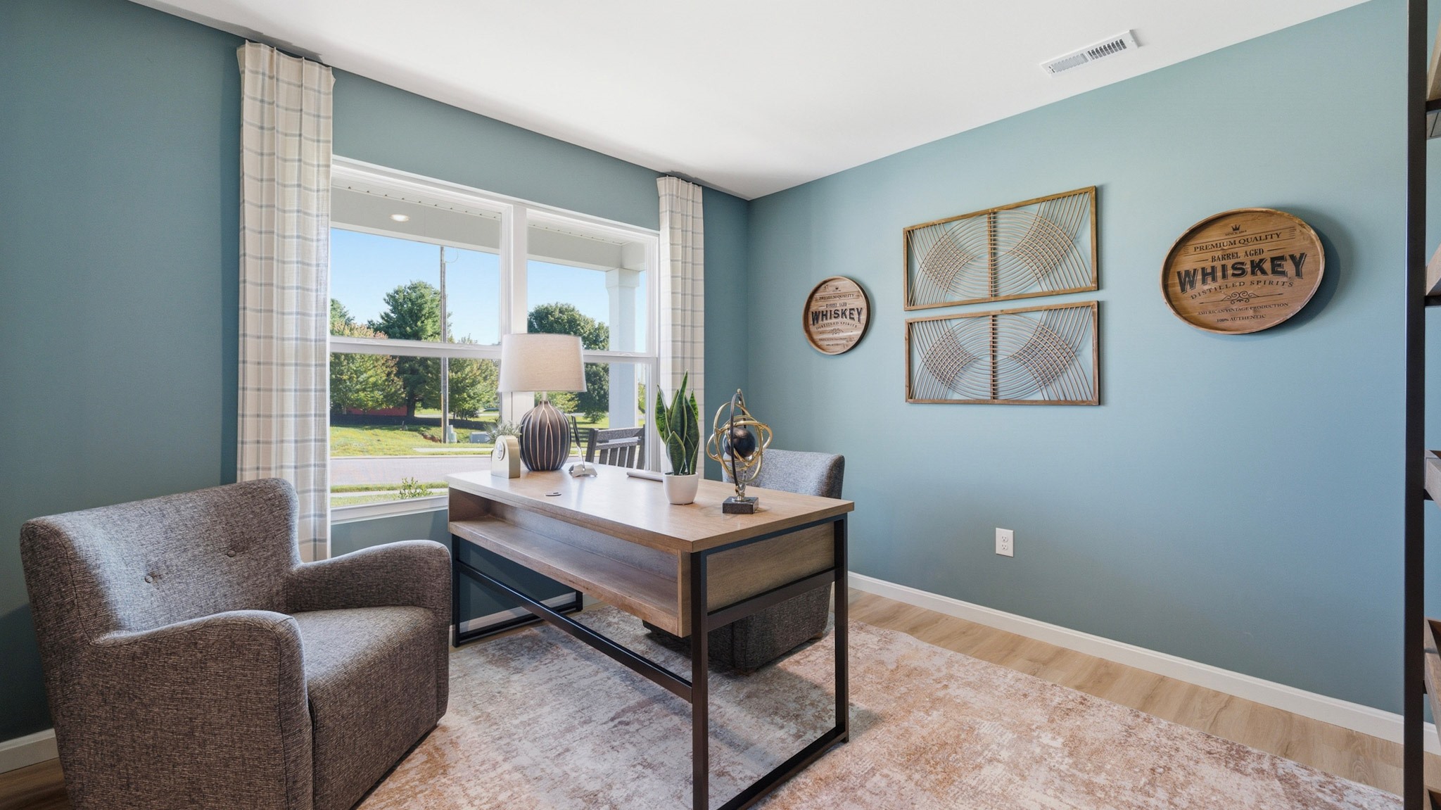 First floor flex room with a double window overlooking the front yard.