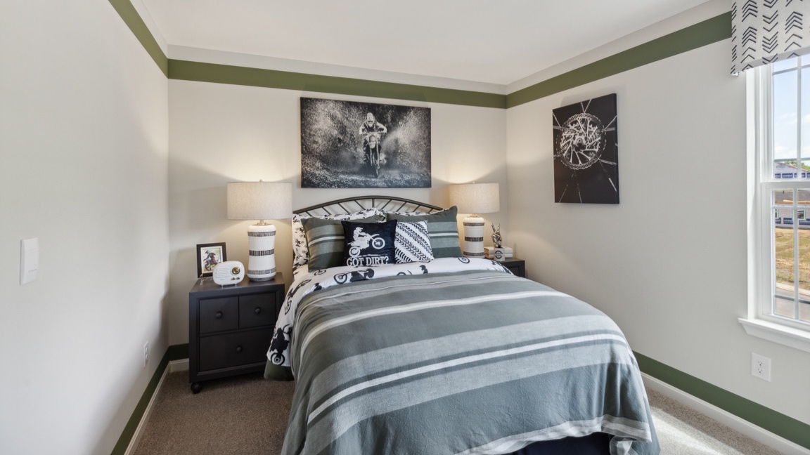 .bedroom 3 with a full bed, nightstand and window