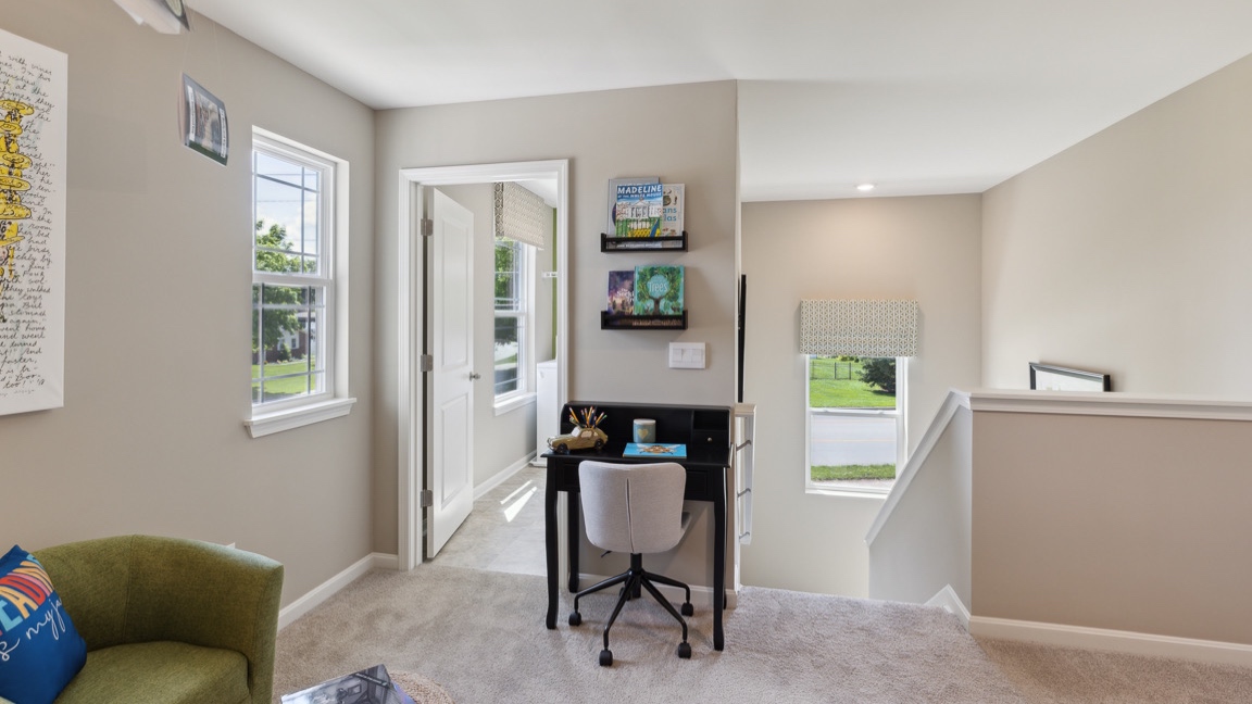 small desk and chair in loft area