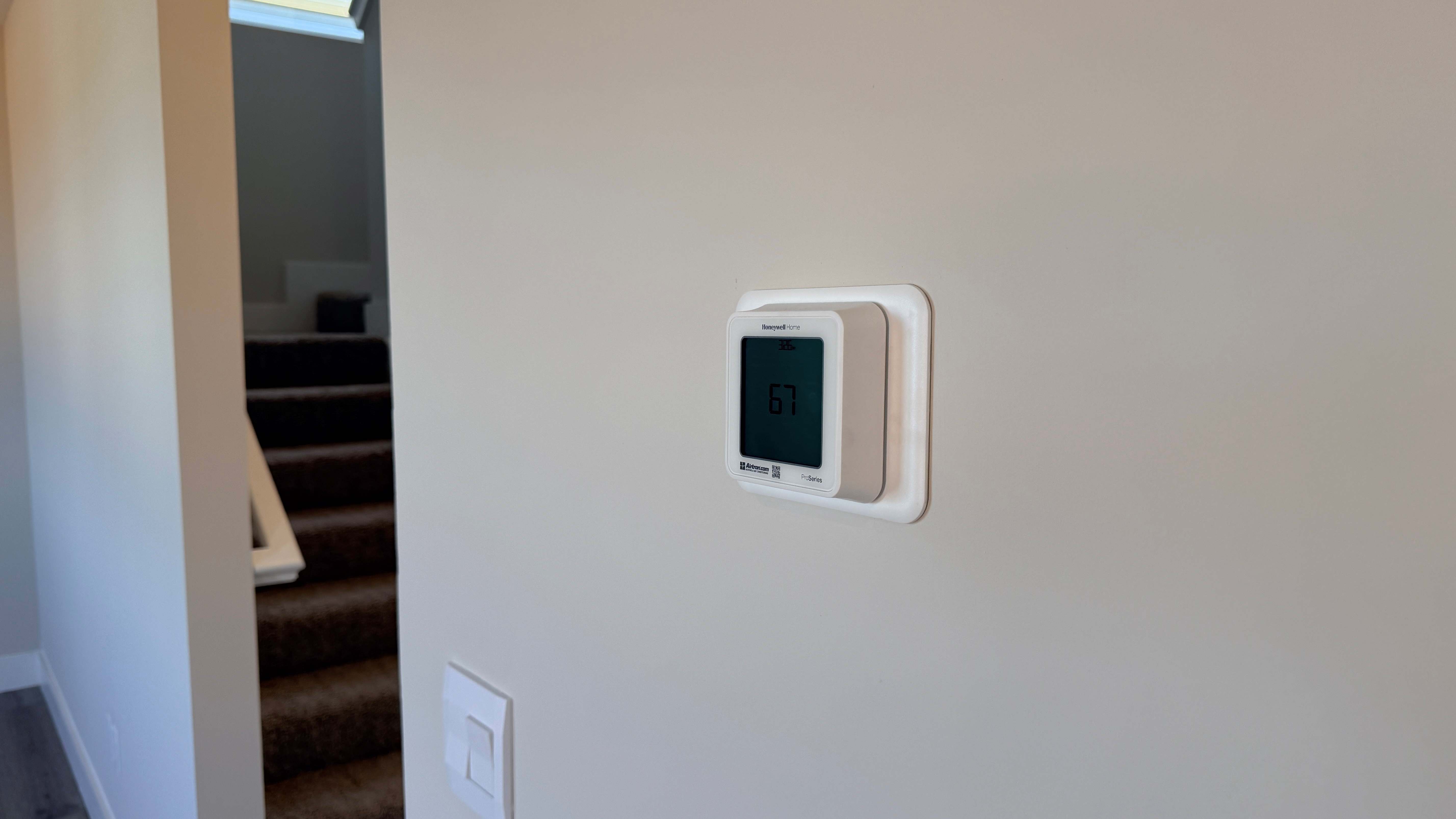 Digital thermostat on the wall.