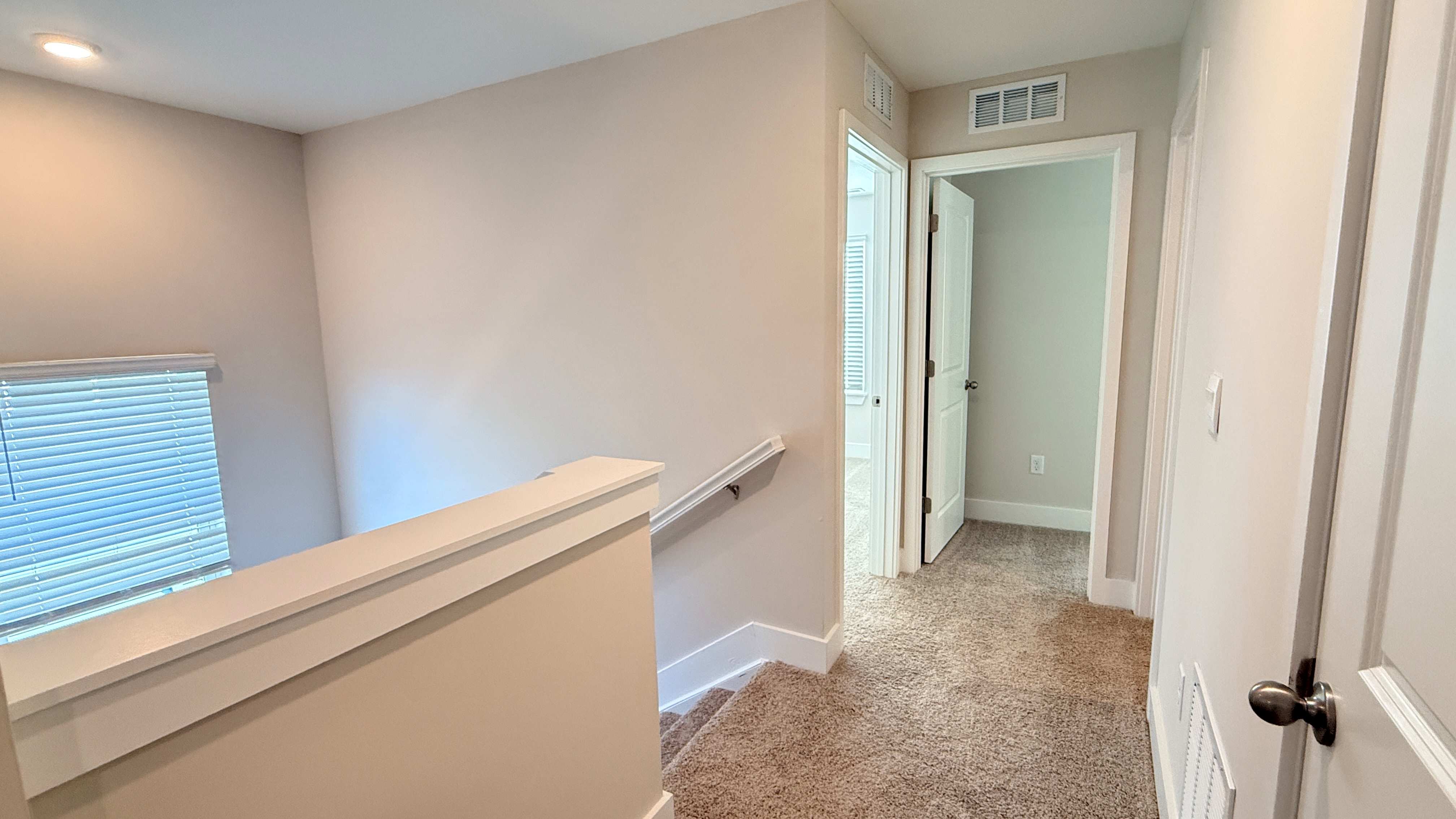 Upstairs hallway overlooking the stairs to lower level.