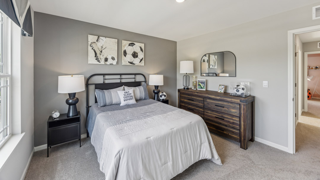 Interior bedroom with window and accent wall
