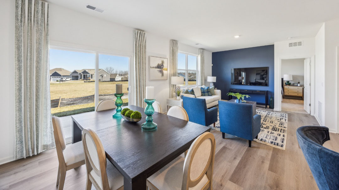 open concept living area featuring the kitchen, living room and dining room all next to each other