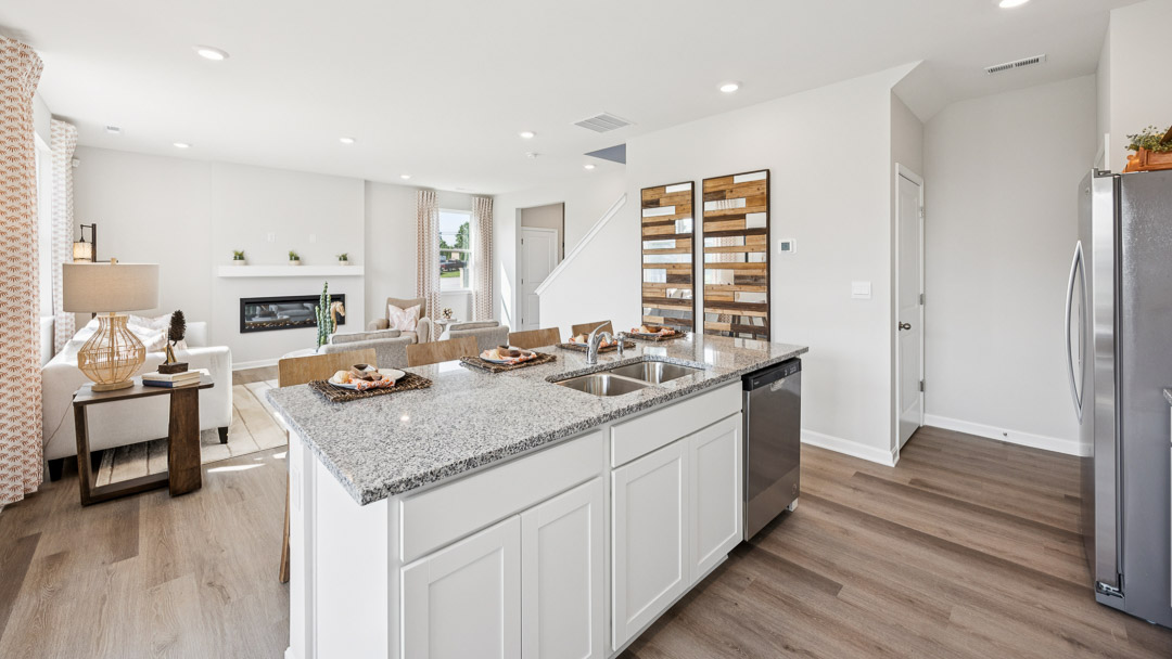 dining room overlooking center island pantry and spacious living room