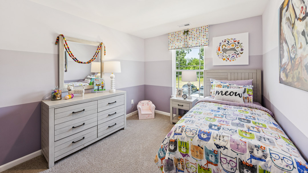 bedroom number 2 with window and dresser