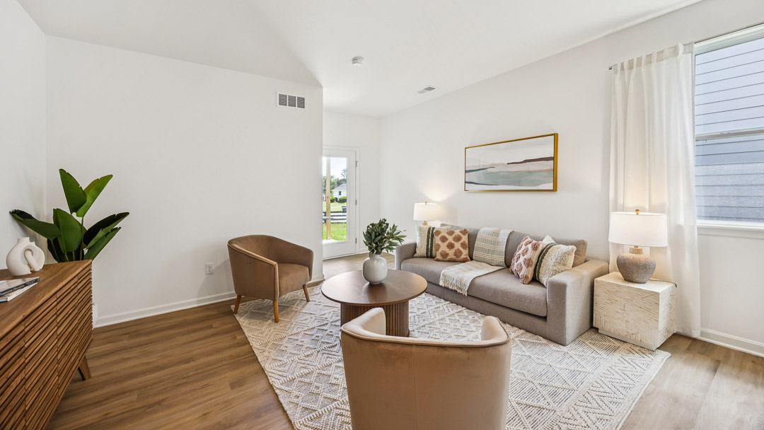 living room with couch and accent chairs
