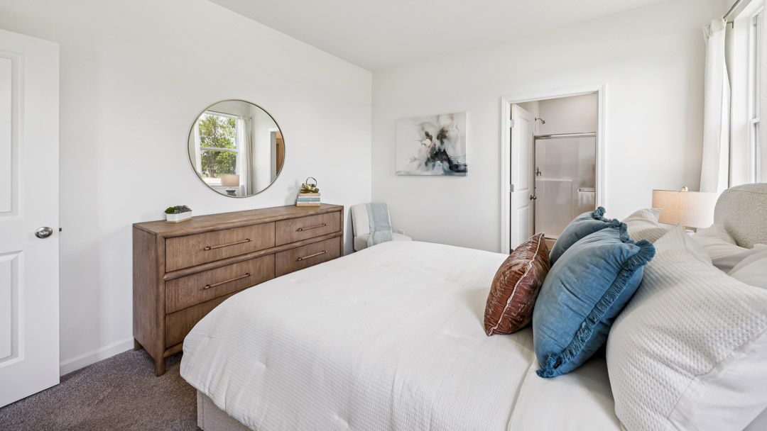 primary bedroom with king size bed and dresser