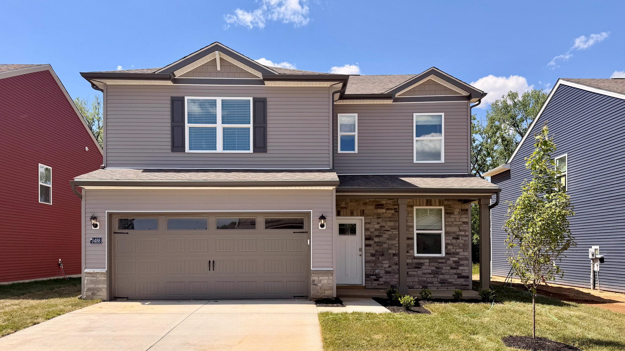 Move-in ready Sienna floorplan by D.R. Horton Homes in Jeffersonville, Indiana. Featuring a covered front porch and 2-car attached garage.