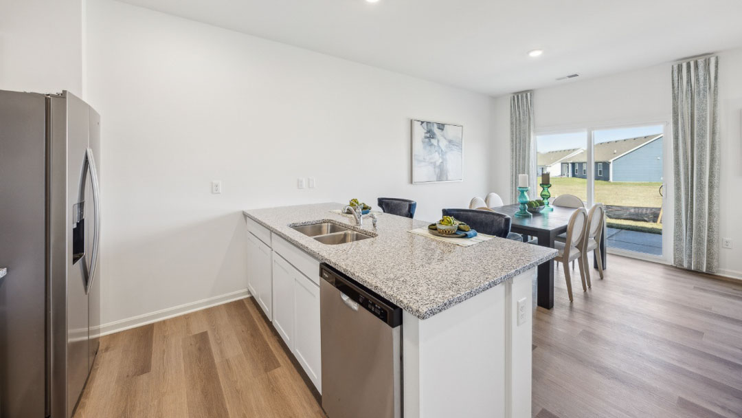Kitchen peninsula with room for seating facing the dining area.