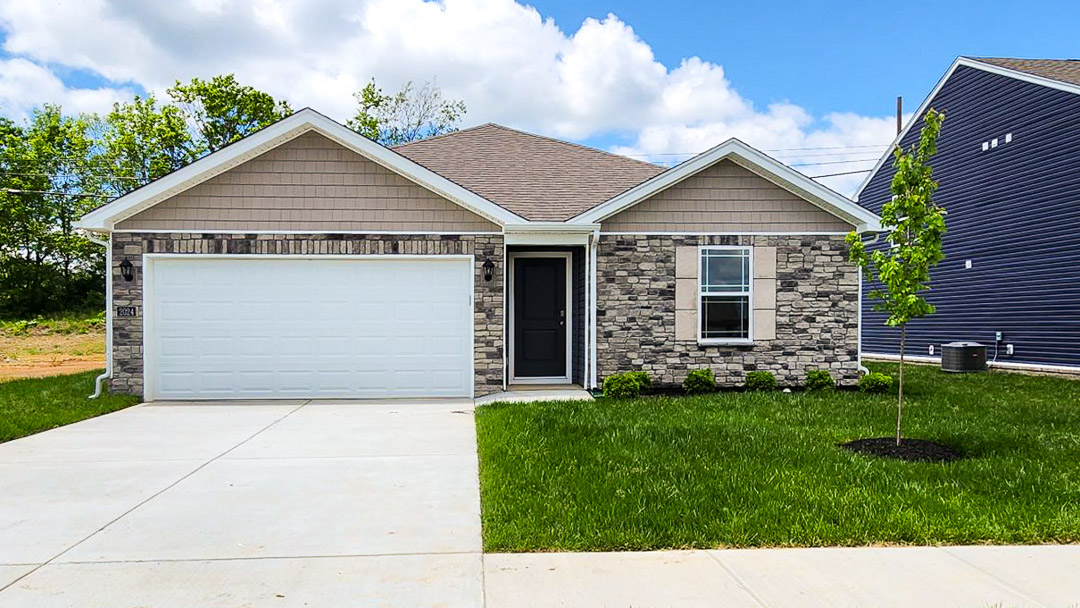 Exterior beige home with stone detailing