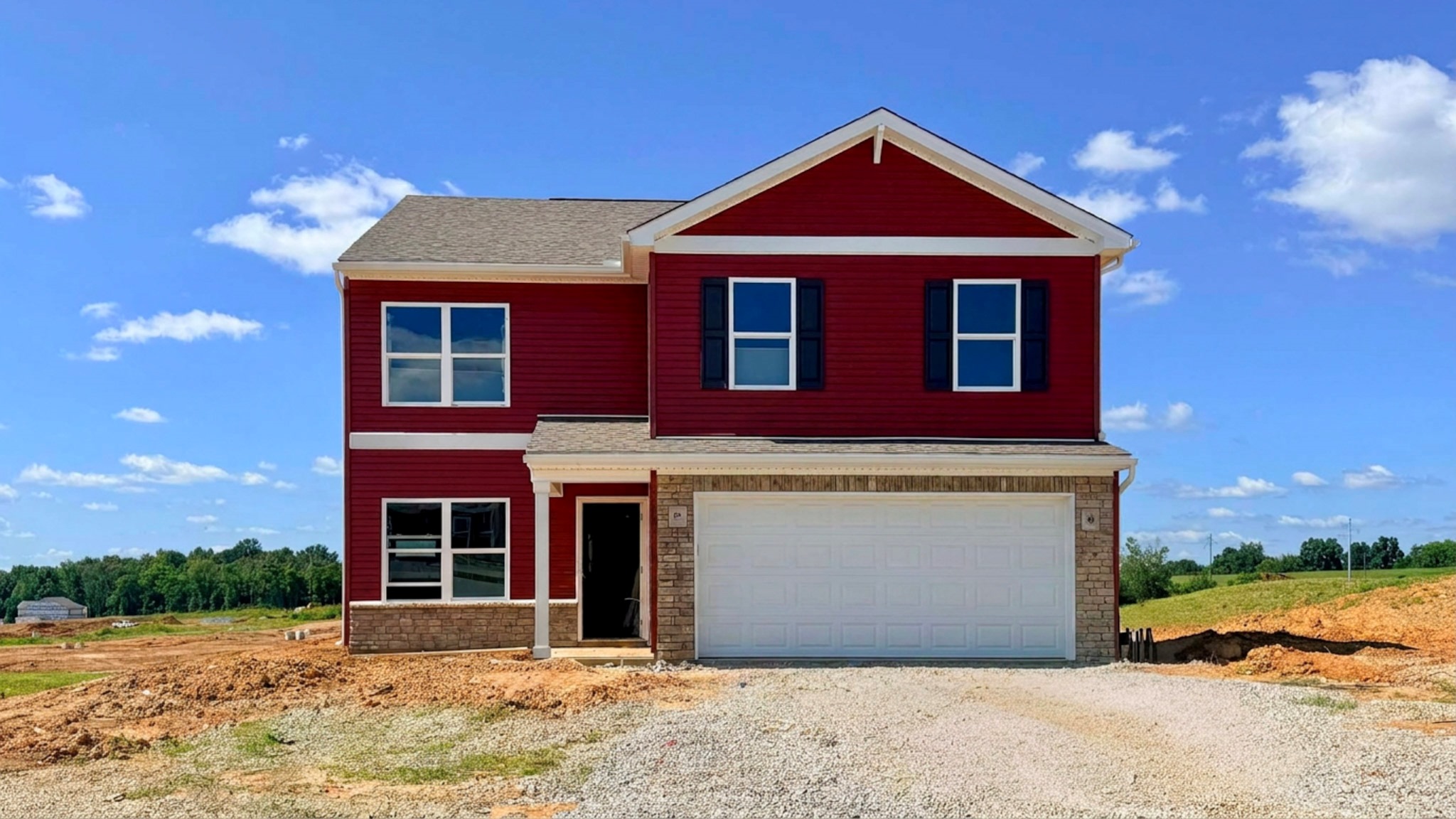 Quick move-in Bellamy floor plan with red siding, covered front stoop, stone accents, and a 2-car attached garage.