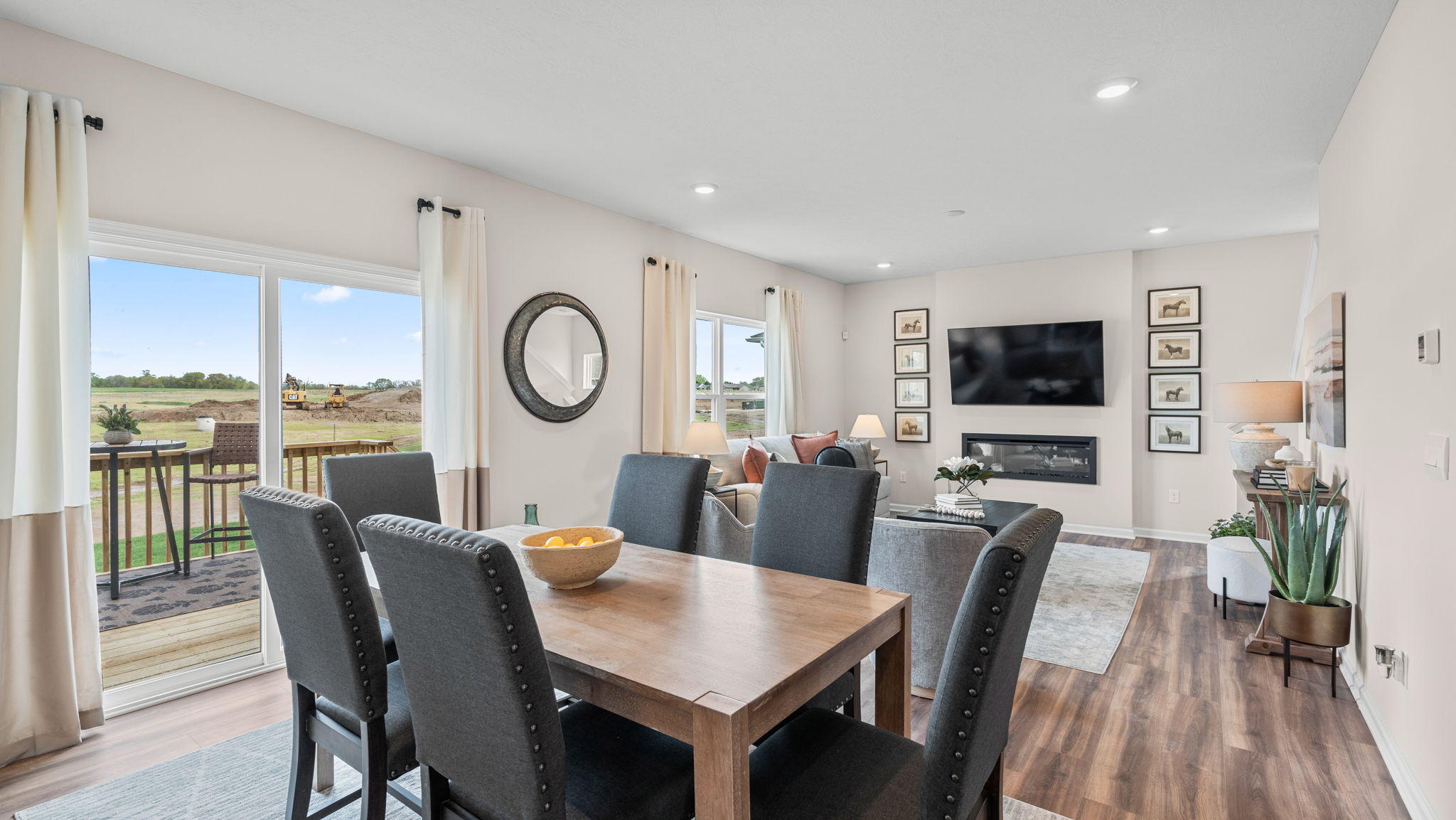 Dining area with rectangular table and chairs.