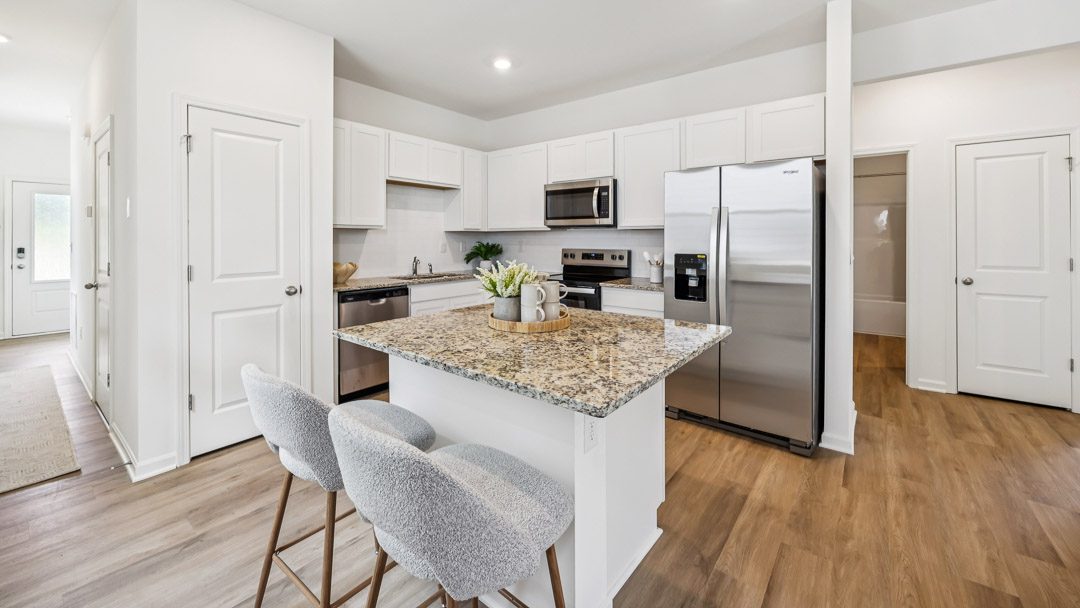 Kitchen with stainless steel appliances and pantry