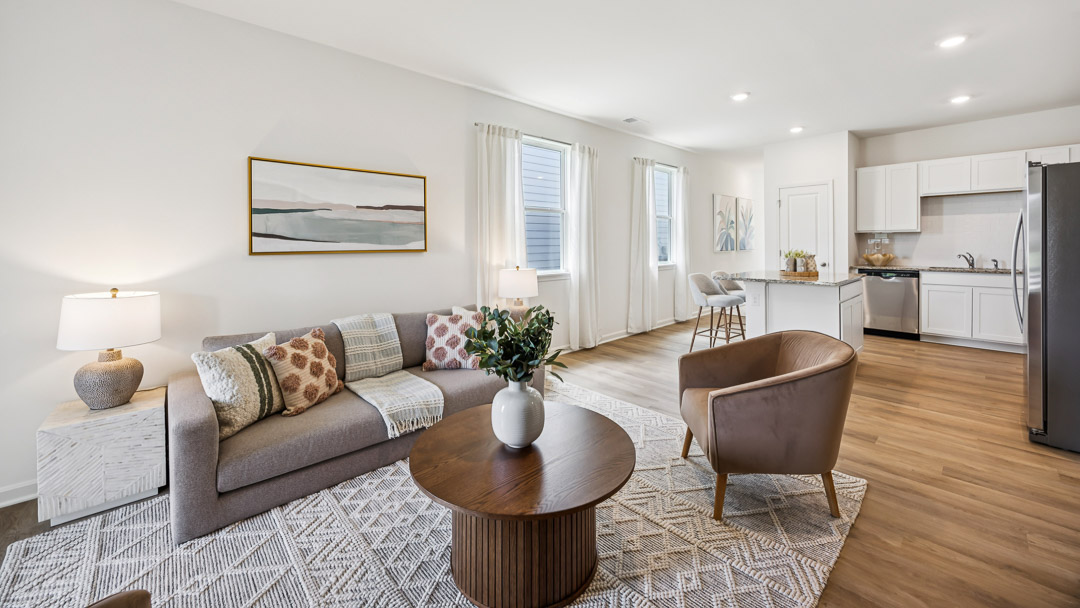 Living room with coffee table, accent chair, couch, and 2 endtables