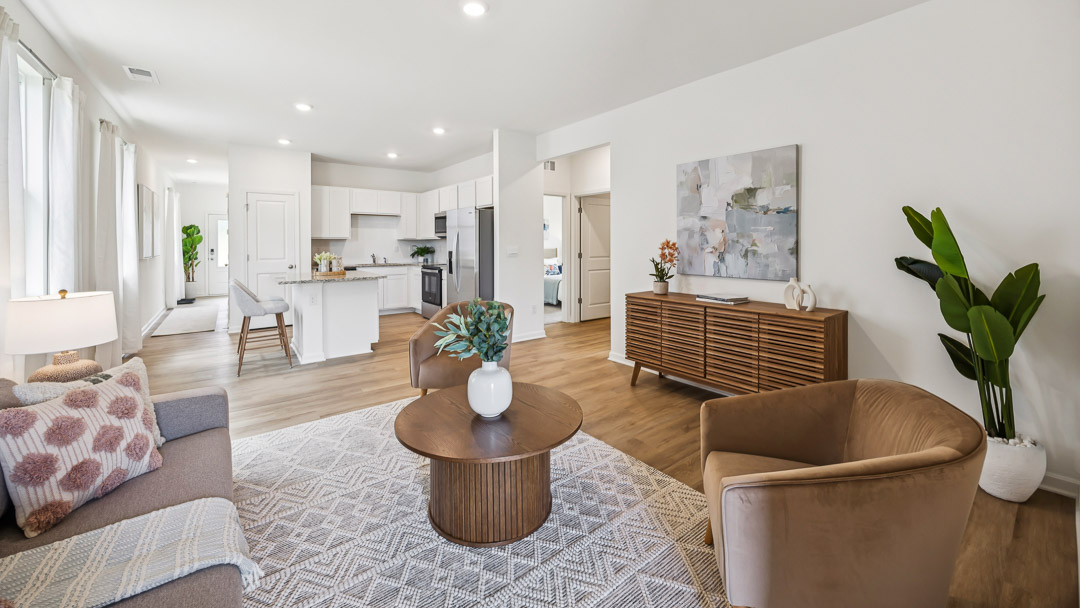 Living room with couch, coffee table, accent chair, tv stand