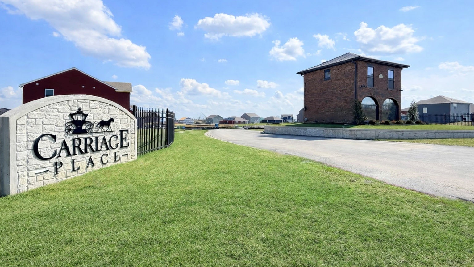 Carriage Place entrance sign and carriage house