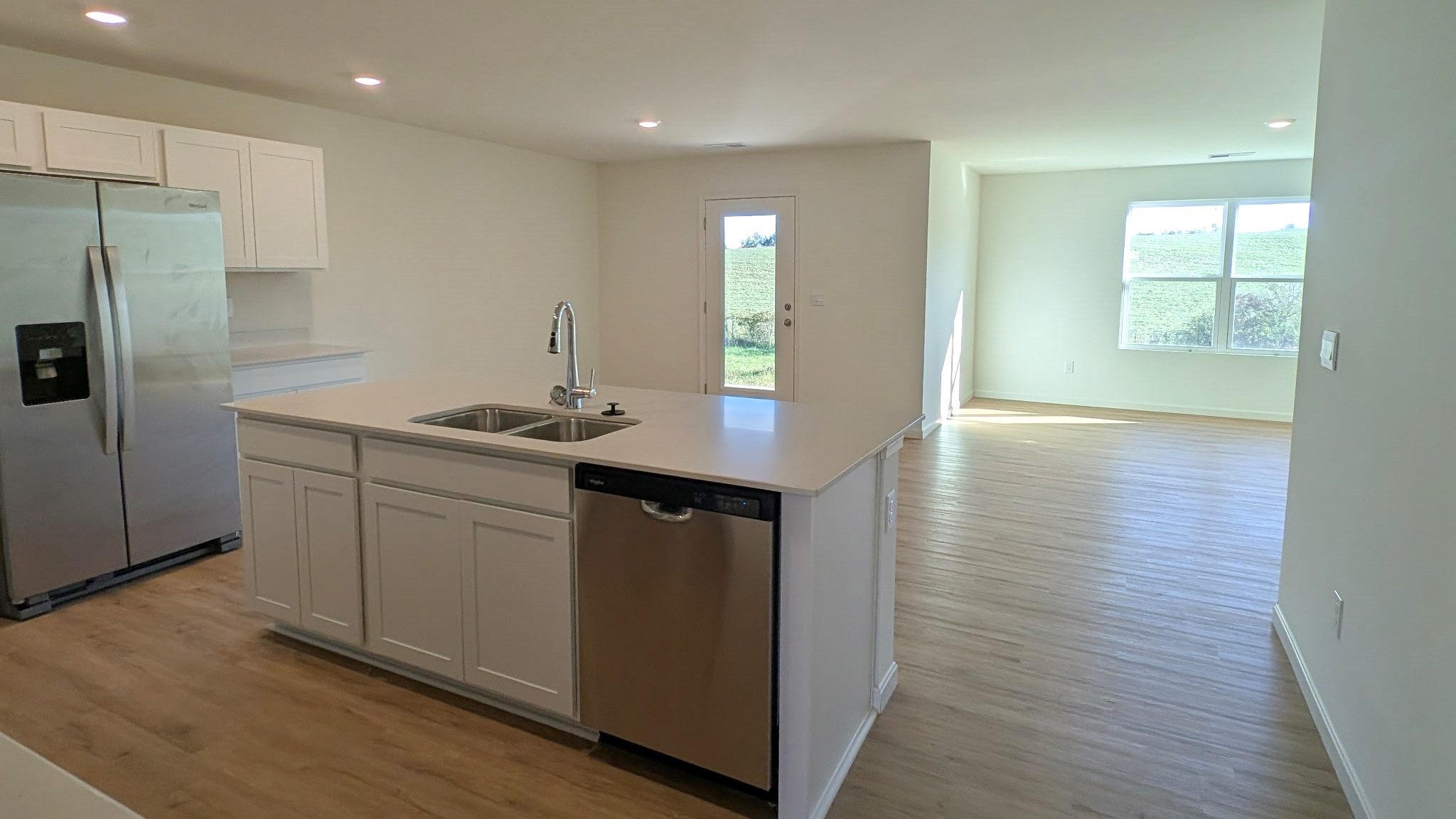 Spacious kitchen with center island overlooking the dining and living room.