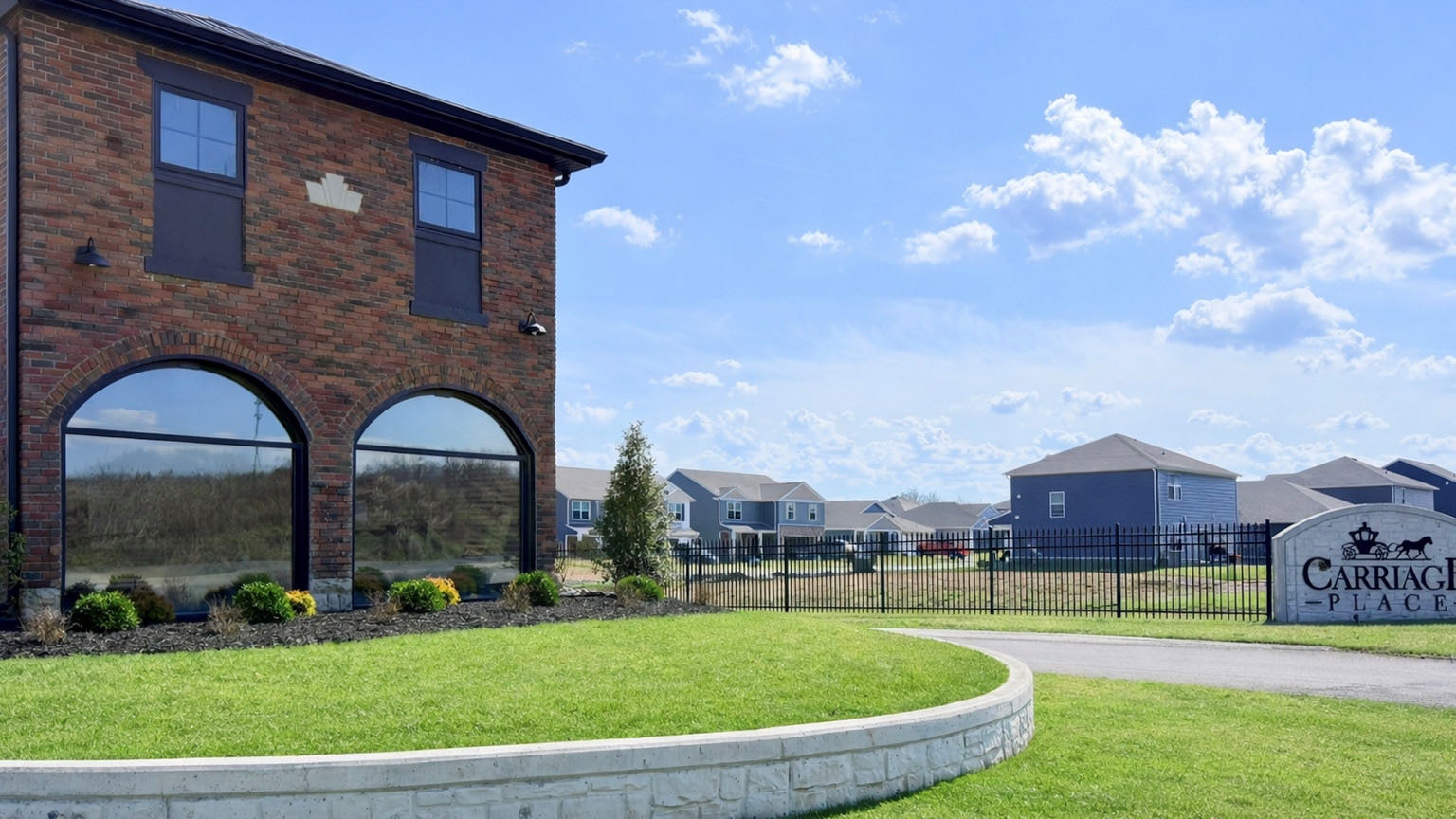Carriage Place entrance with carriage house.