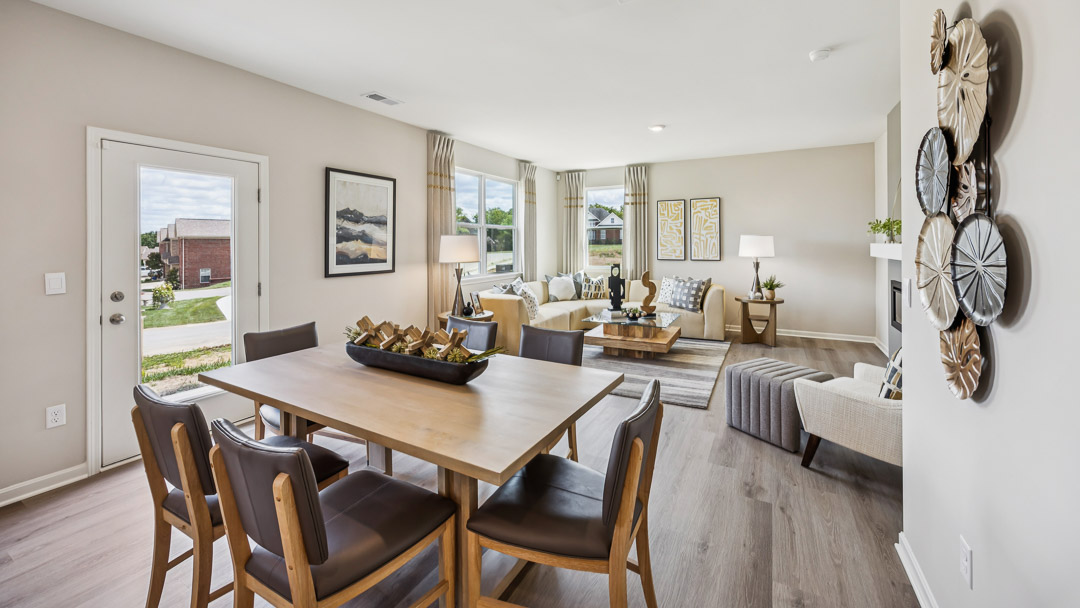 Dining area with rectangular table and six chairs.