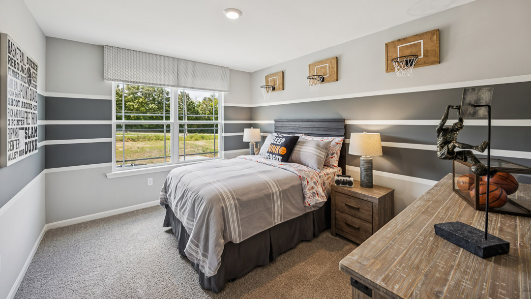 Upstairs spare bedroom with double window, bed, 2 nightstands, and dresser.